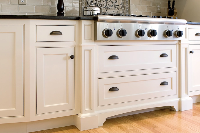 Custom white kitchen cabinetry and agas cooking range