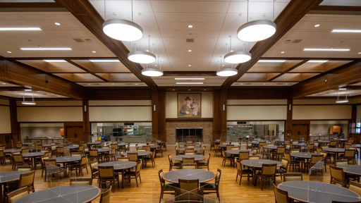 a large dining room with tables and chairs