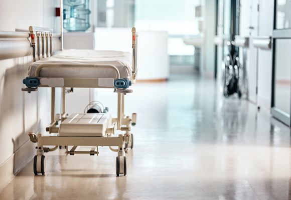 Hospital bed along the hallway