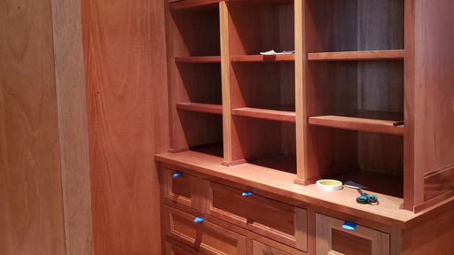 a wooden bookcase cabinet