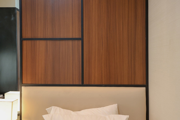 Bedroom walls are lined with HPL