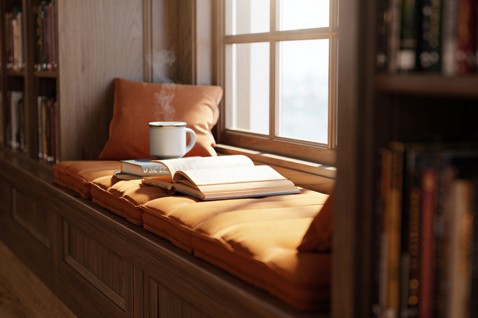 A window seat with built-in bookshelves