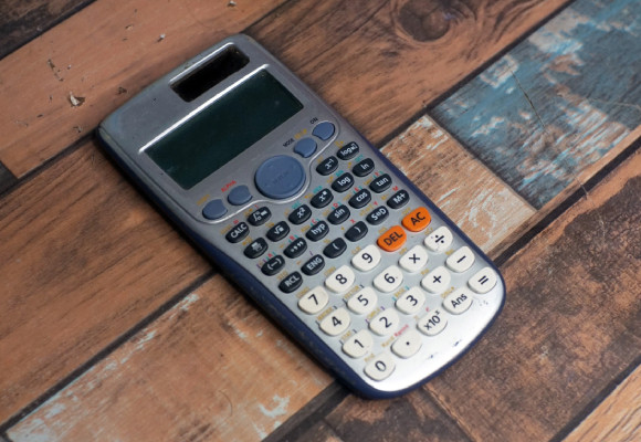 Calculator in wood background