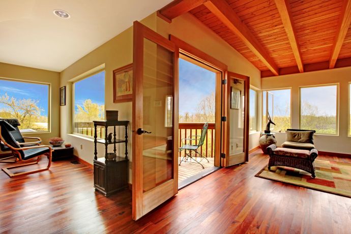 Modern living room with wood ceiling and floor.