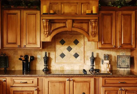Custom oak wood Cabinets in a luxury home kitchen with tile backsplash
