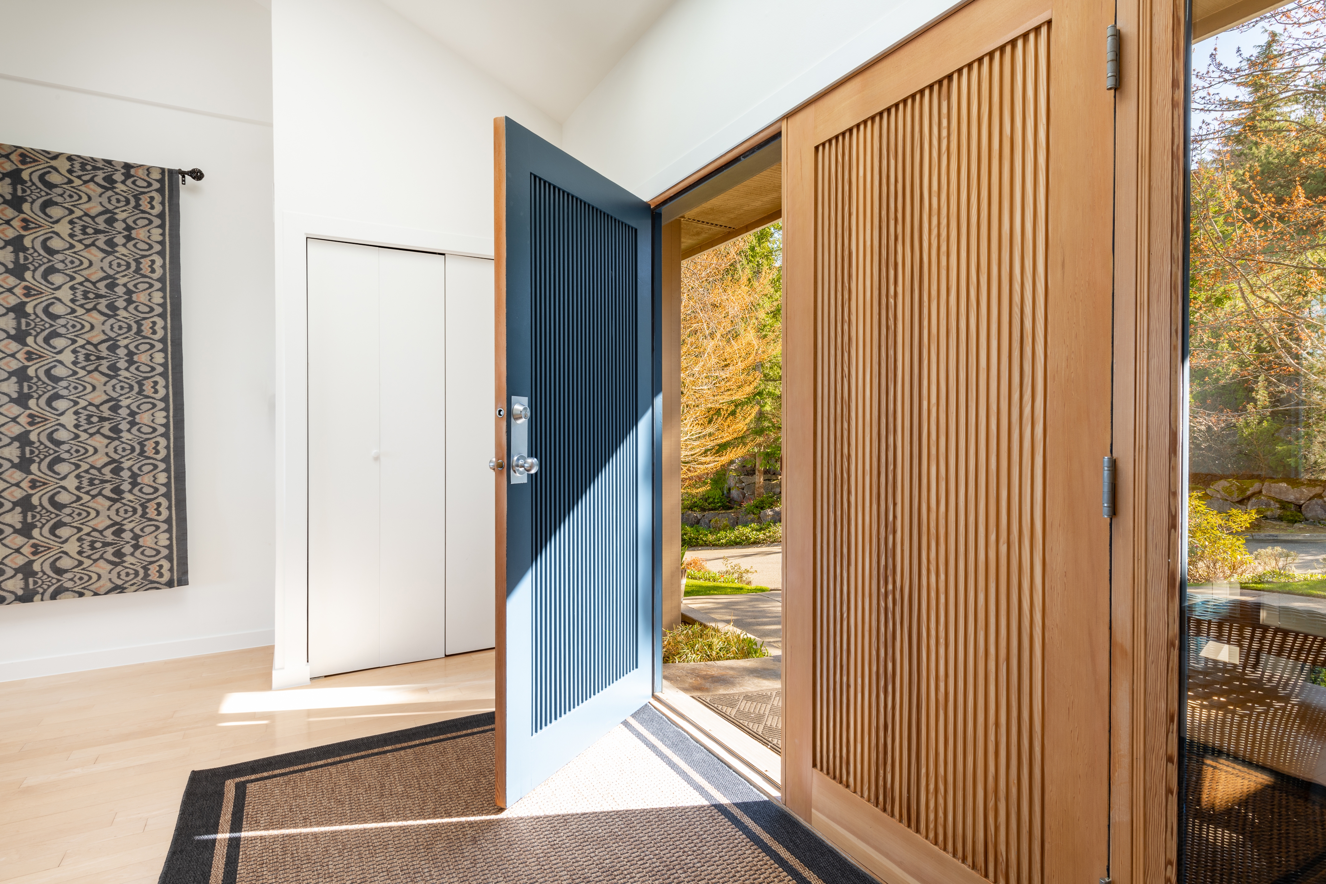 home entryway with custom woodwork front door