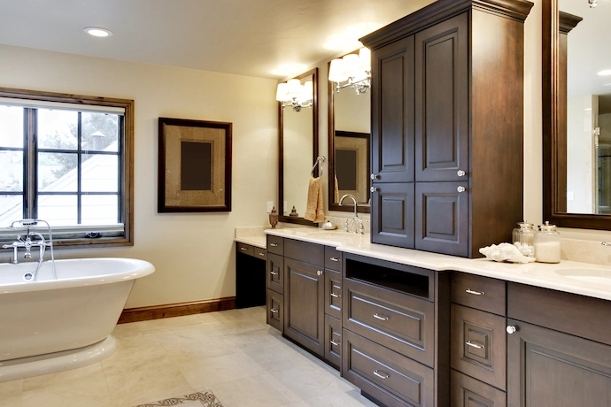 new dark wood cabinets in a newly renovated bathroom with a free standing tub