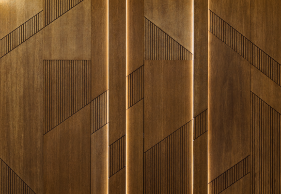 Hidden door installation and wooden panel in modern interior design of the reception of the house.