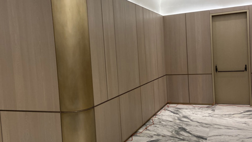 an elevator in a building with marble floors