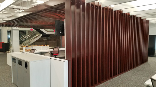 an office with wooden dividers and a desk