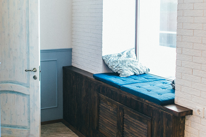 A window seat with built-in drawers