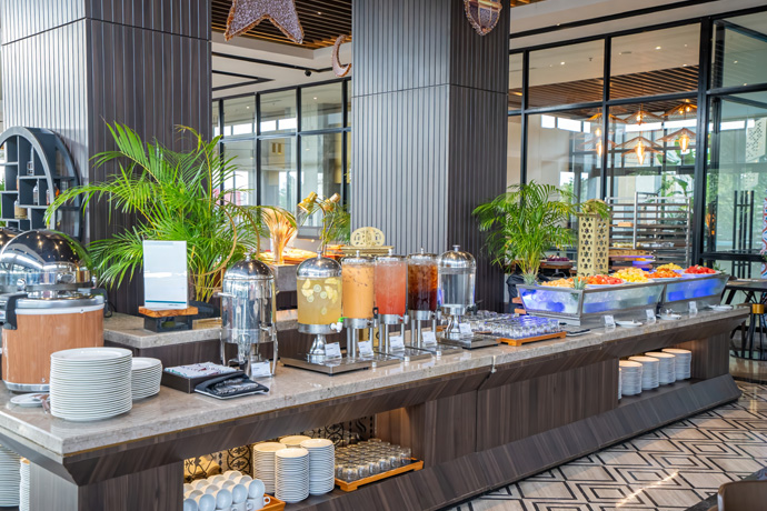 Buffet table with juices and fruits