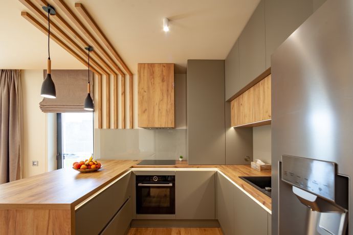 Photo of modern kitchen with sleek contemporary cabinetry
