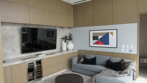 a television on the wall and a couch