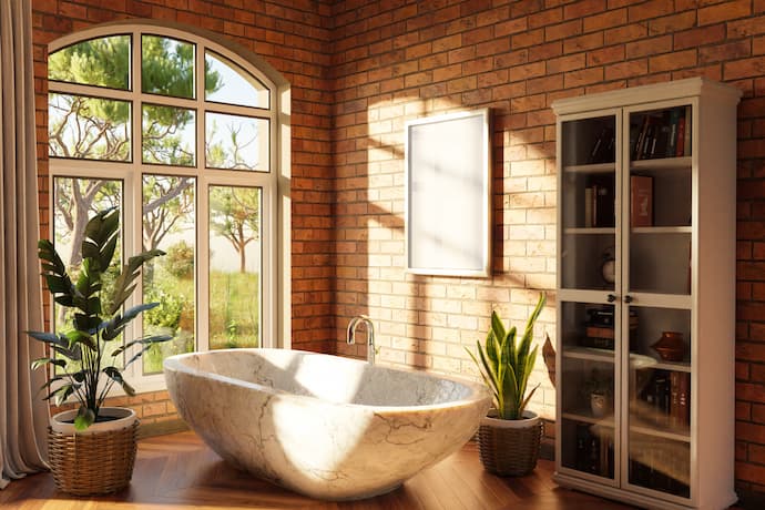 Luxury bathroom renovation with brick wall interior and wood flooring