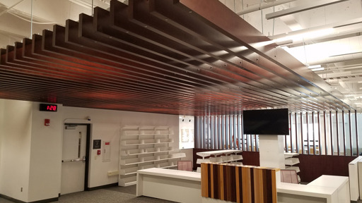 an office with a wooden ceiling and a desk