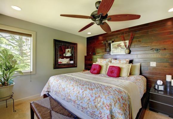 Image of a bedroom with a wooden accent wall